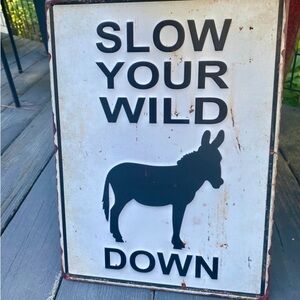 Slow your WILD A!! Down Tin Sign